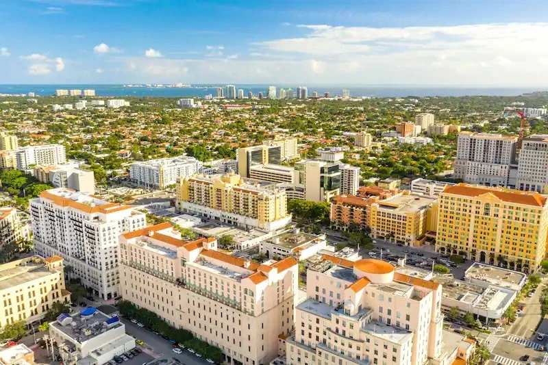 Coral Gables' lush greenery, blue skies, and captivating architecture in this tranquil Miami neighborhood.